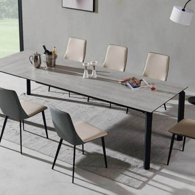 Oval extendable ceramic dining table with swivel extending mechanism